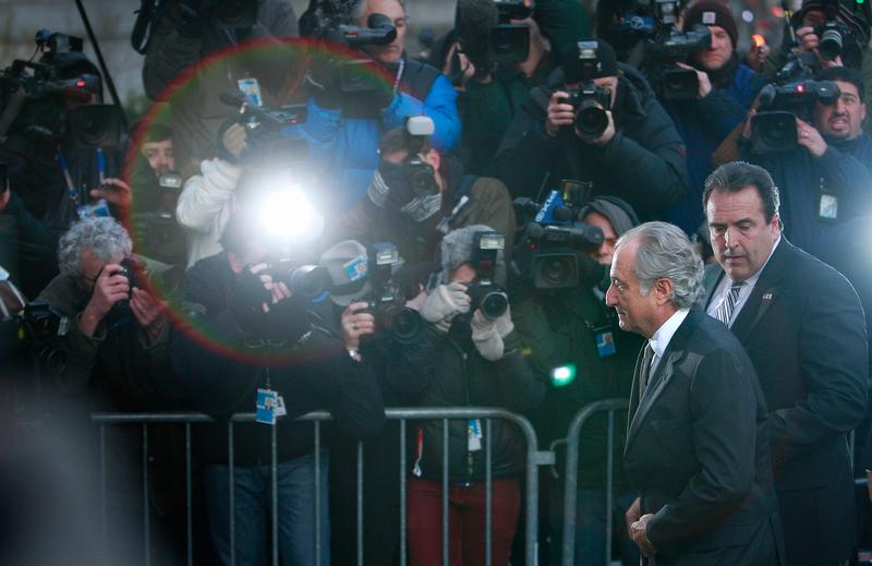 Disgraced financier Bernard Madoff passes a police barricade as he arrives at court on March 12, 2009 in New York City
